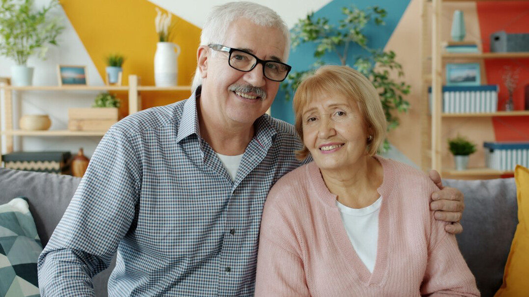 elderly couple smiling