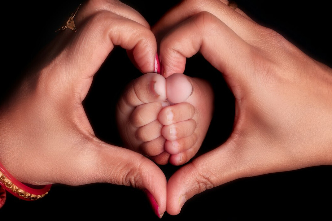 newborn baby with parents